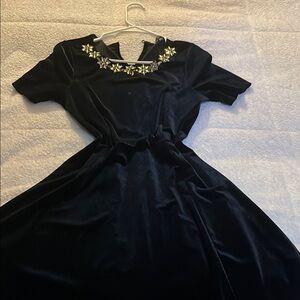 Elegant Black Dress with Floral Embellishments